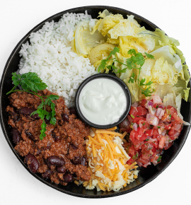 Burrito bowl with beef, kidney beans, tomato salsa, and sour cream