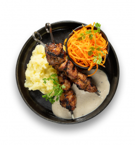 Grilled pork skewers with mushroom sauce