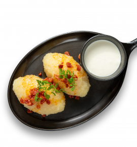 Potato dumplings stuffed with meat and chorizo chips